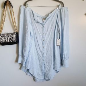 Off shoulder baby blue button down shirt.